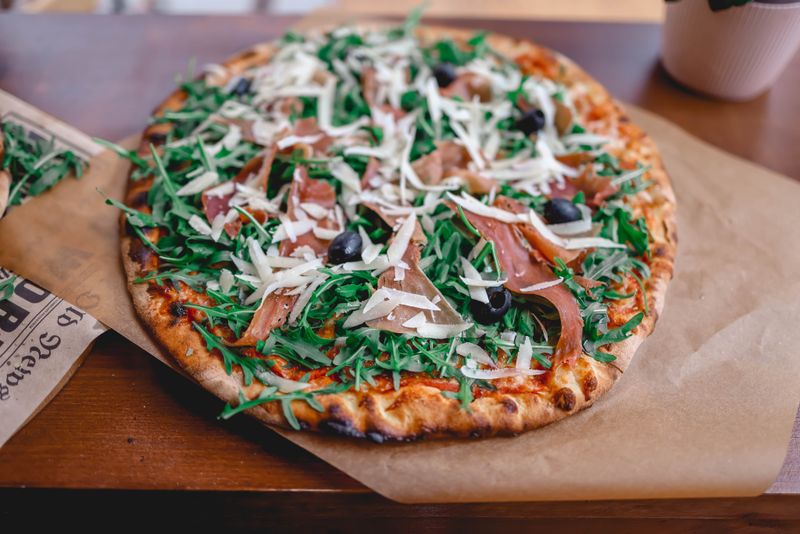 Prosciutto and fig punch pizza with gorgonzola and arugula